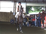 Merate settembre 2001 - Prima manifestazione di equitazione - ragazza a cavallo durante la gara con pubblico alle spalle